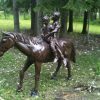 two children on horse aluminum statue side view